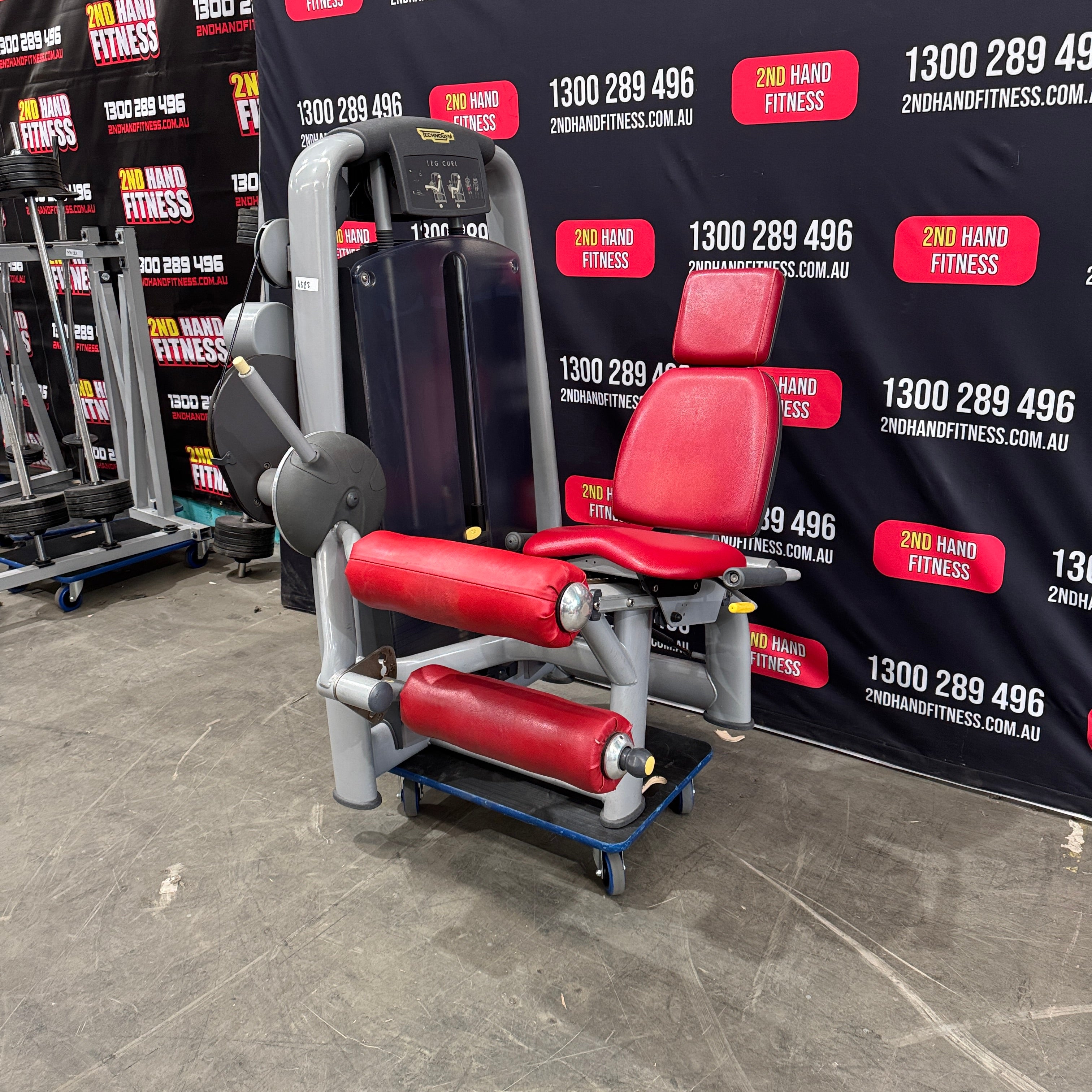 Technogym Selection Leg Curl - Silver Frame, Red Upholstery
